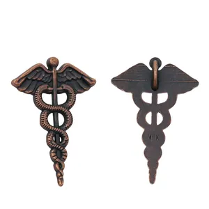 Detail of Caduceus wing snake pendant in antique copper with front and back views