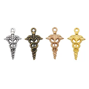 Lot de 4 pendentifs caducée vintage en finitions argent bronze or rose et or brillant