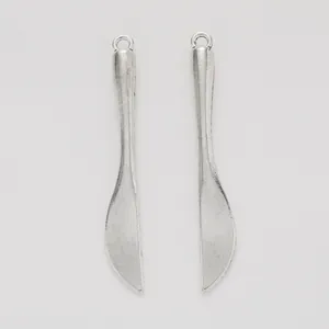 Pair of vintage silver alloy knife pendants for DIY jewelry making and craft projects