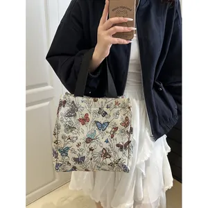 Floral butterfly tapestry tote bag with black handles for stylish daily commuting