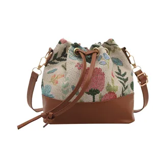 Ethnic retro bucket bag with floral jacquard fabric and dark brown leather drawstring