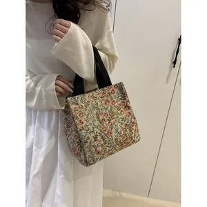 Floral embroidery tote bag with black canvas handles and large capacity for daily use