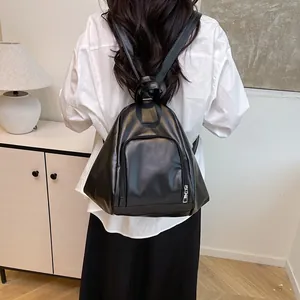 Minimalist black PU leather backpack with triangle design and external zipper pocket