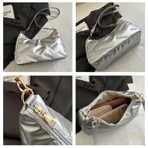 Details einer silbernen Stepptasche mit Innenraumkapazität und Reißverschluss-Zoom