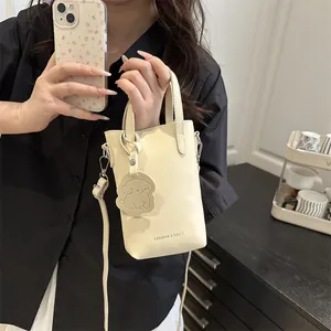 Women Vertical PU Leather Mobile Phone Bag Minimalist Small Bucket Crossbody Bag With Puppy Pendant Fashion Shoulder Bag