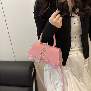 Pink PU leather crossbody bag with woven texture, S-letter logo and tassel charm