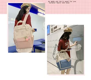Detail view of contrast-colored canvas backpack with cute patterns and multiple pockets
