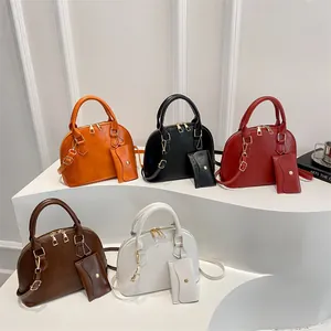 Chic shell-shaped handbag set with matching coin purse in five elegant colors