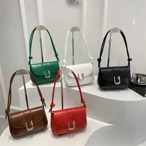 Minimalist leather shoulder bags in multiple colors featuring silver U-shaped buckles
