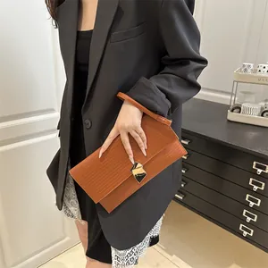 Chic brown pleated clutch bag with gold geometric buckle and wristlet strap for women
