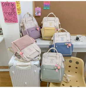 Collection of lightweight mini waterproof backpacks in five macaron colors with strawberry charm