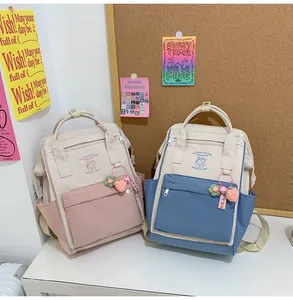 Close-up of lightweight waterproof mini backpacks with cute patterns and charms