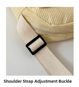 Close-up of the adjustable buckle on the yellow corduroy crossbody bag strap