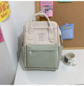 Detail of a compact waterproof backpack with ice cream graphic and front zip pocket