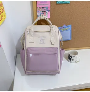 Detail of lavender and cream waterproof mini backpack with ice cream logo and dual handles