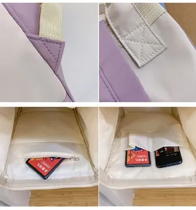 Detail of reinforced stitching and interior pockets of a purple waterproof mini backpack
