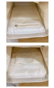 Detail view of the backpack interior showing a zipper pocket and two open slip compartments