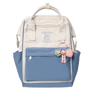 Lightweight canvas backpack in cream and blue patchwork with embroidered ice cream design
