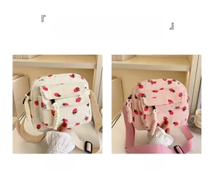 Corduroy crossbody bags in off-white and pink colors featuring cute strawberry prints