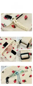 Detail view of corduroy texture and red strawberry print on this white shoulder bag