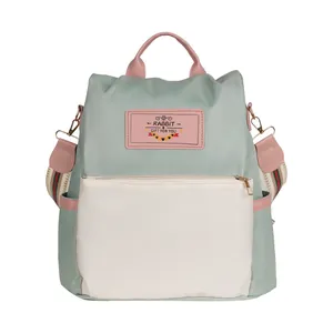 Sac à dos antivol en tissu Oxford avec design patchwork vert menthe et rose tendance