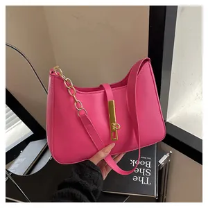 Women's rose pink hobo shoulder bag with a gold chain strap and metal buckle