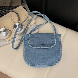 Retro denim mini shoulder bag for women with flap closure and crossbody strap