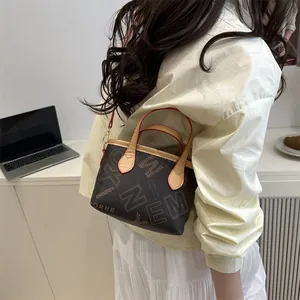 Vintage brown monogram bucket tote bag with leather top handle and shoulder strap for women