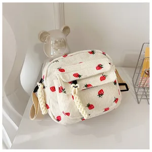 Corduroy crossbody bag with cute strawberry print and front flap pocket in cream white