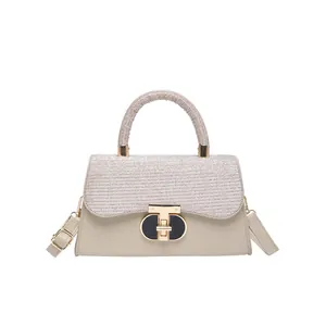 Elegant beige woven texture shoulder bag with metallic T-lock and adjustable leather strap