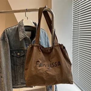 Large dark brown minimalist tote bag with Fanyissa lettering for casual daily commuting