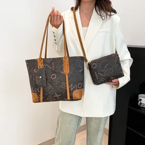 Large vintage print tote bag with matching pouch and brown leather trim for urban commute