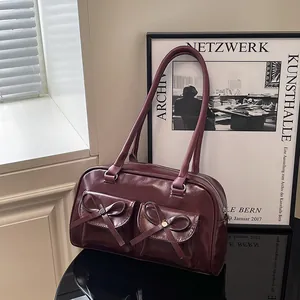 Deep burgundy balletcore shoulder bag with bow details and front flap pockets