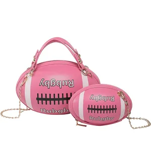 Pink rugby-shaped crossbody bag set with chain strap and matching small coin purse