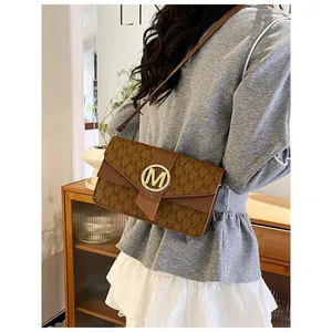Classic brown flap shoulder bag with M monogram print and golden metal logo buckle