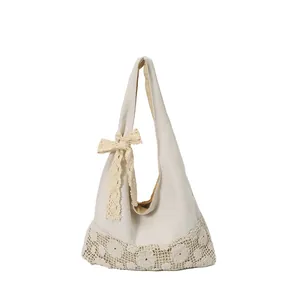 Summer canvas beach tote with hollow crochet flower trim and lace bow decoration
