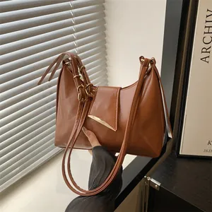 Classic brown retro underarm bag in glossy faux leather with gold hardware for women