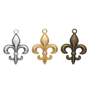 Three fleur-de-lis charms in silver, gold, and bronze finishes for DIY jewelry making