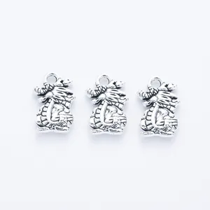 Three vintage zinc alloy dragon pendants for DIY jewelry making in antique silver finish