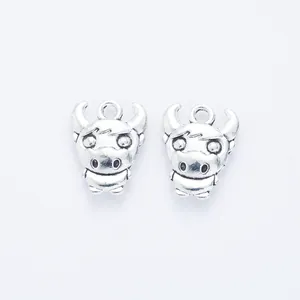 Pair of vintage silver cartoon cow charms in zinc alloy for DIY jewelry and crafts