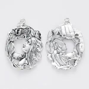 Vintage zinc alloy pendant featuring Art Nouveau female face relief and silver finish