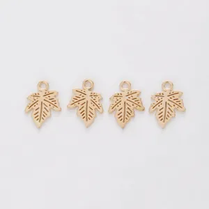 Set of four gold-plated maple leaf pendants with hollow details for DIY jewelry making