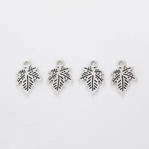 Set of four vintage zinc alloy maple leaf pendants with intricate veined textures