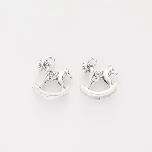 Vintage silver alloy rocking horse charms for DIY jewelry making on white background