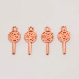 Macro detail of four rose gold lollipop pendants for DIY jewelry making and crafts