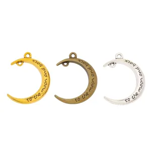 Three crescent moon charms in gold bronze and silver with to the moon and back engraving