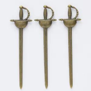 Three vintage bronze alloy miniature sword pendants with classical guard and spiral handle