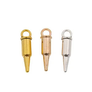 Three bullet-shaped alloy pendants in gold, rose gold, and silver for DIY jewelry
