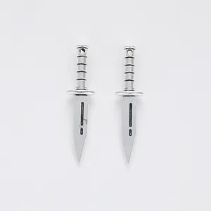 Pair of vintage silver alloy dagger charms for DIY jewelry making on white background