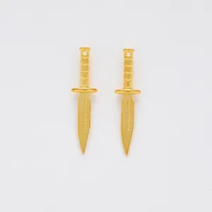 Pair of vintage gold alloy dagger charms for DIY jewelry making with matte finish